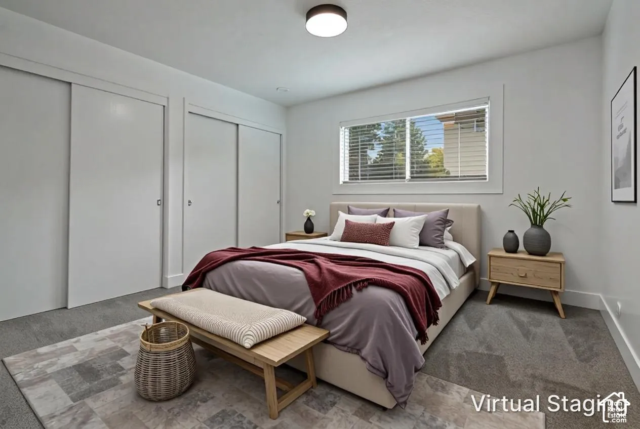 Neutral interior featuring wall-to-wall carpeting, dual sliding closet doors, and a central flush-mount ceiling light fixture