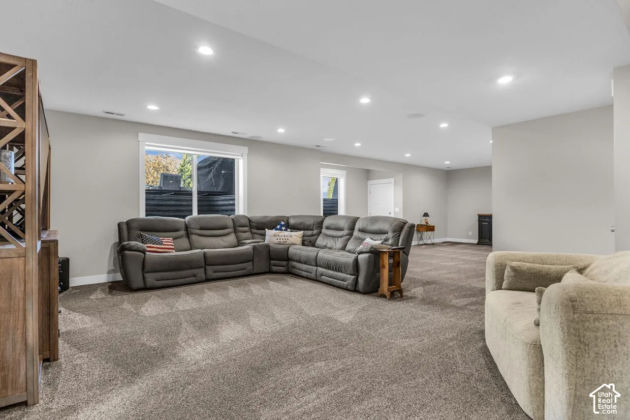 Spacious interior featuring recessed lighting, neutral wall paint, and wall-to-wall carpeting