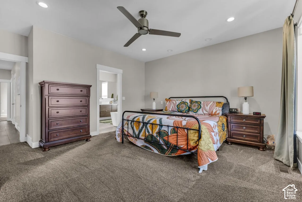 Neutral-toned room featuring recessed lighting, a modern ceiling fan, and wall-to-wall carpeting