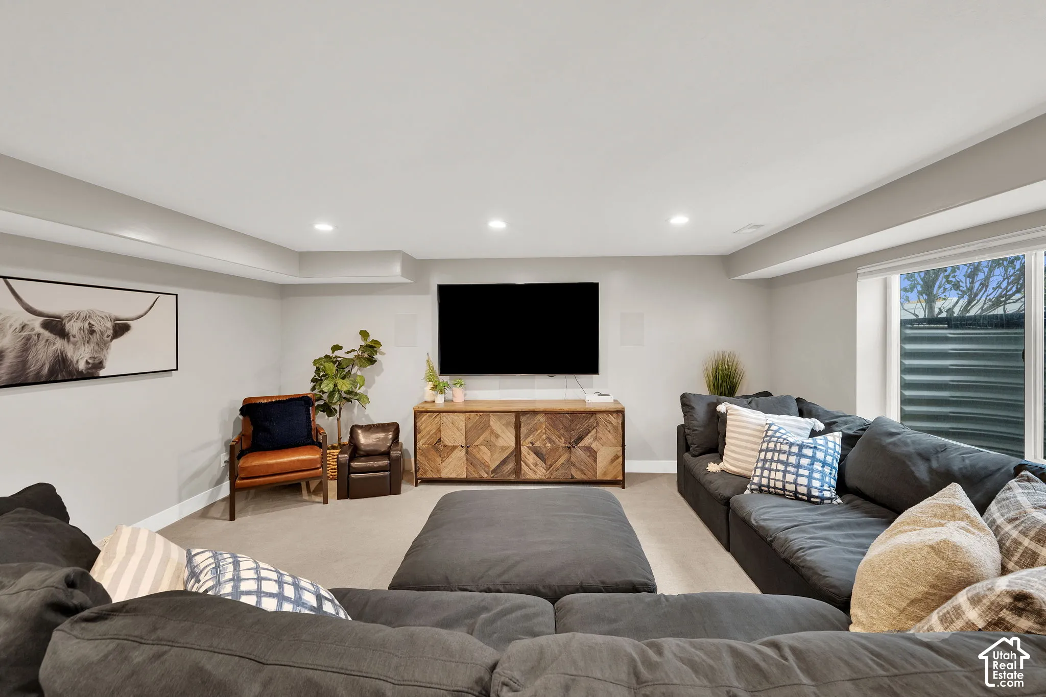 Interior space featuring recessed lighting, carpeted flooring, and an egress window