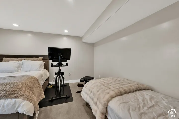Neutral-toned interior space featuring recessed ceiling lighting and wall-to-wall carpeting
