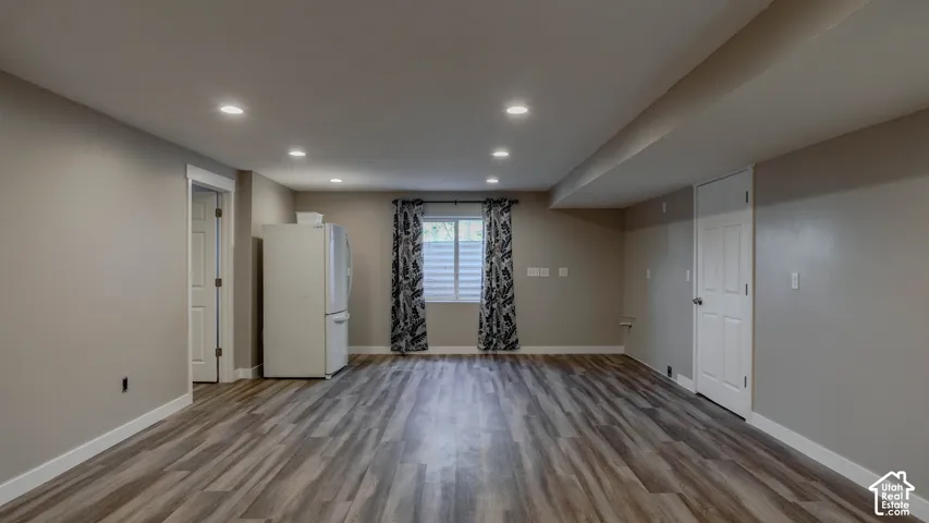 Interior space featuring wood-finish flooring, recessed lighting, and neutral wall paint