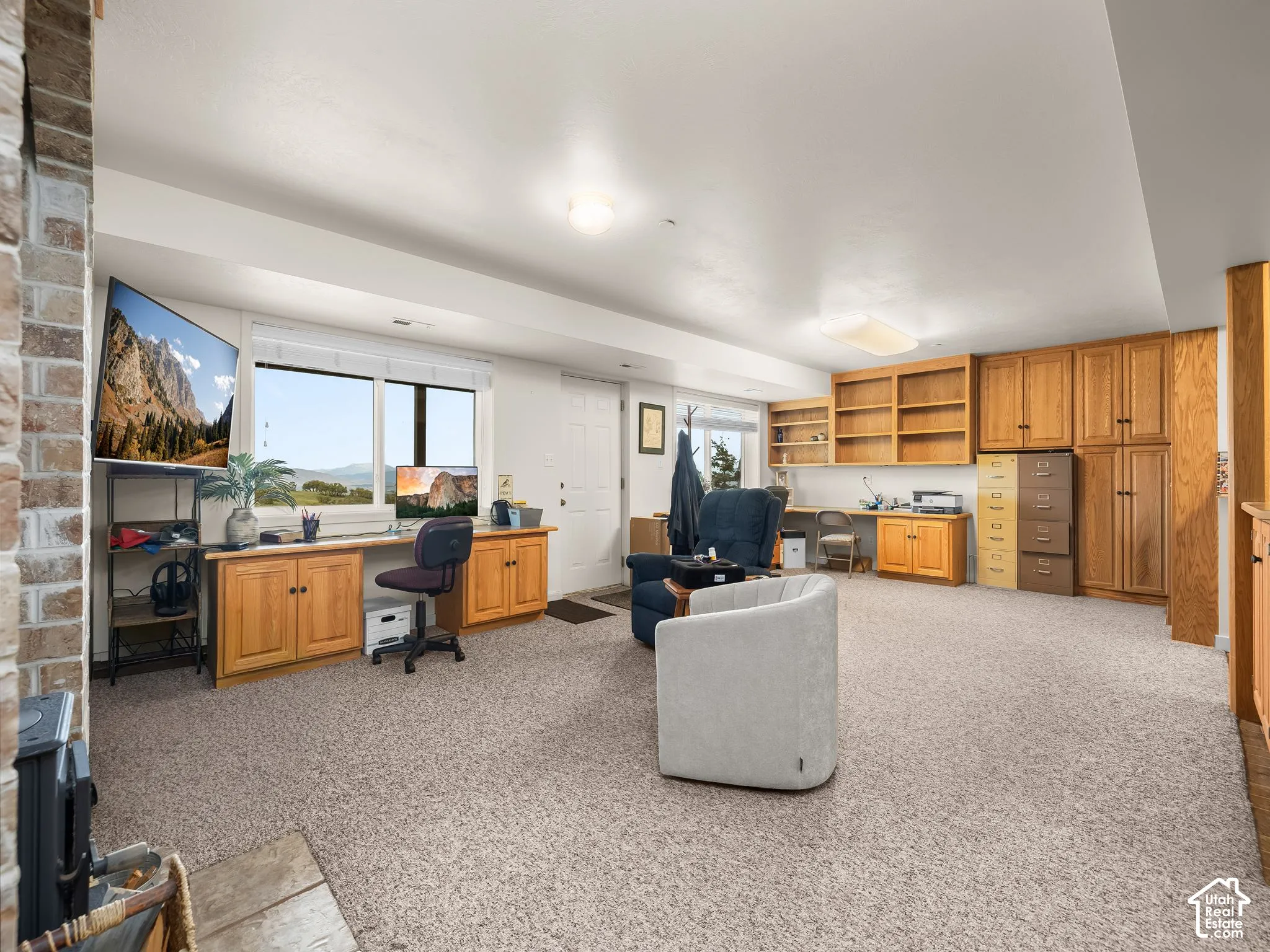 Basement gathering room, office and built ins.