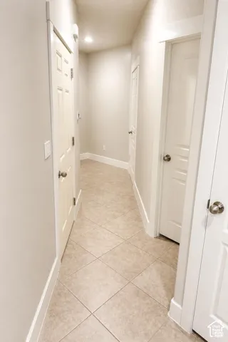 Entry Hallway featuring neutral-toned tile flooring