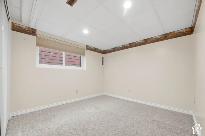 Room featuring neutral wall-to-wall carpeting, and recessed lighting