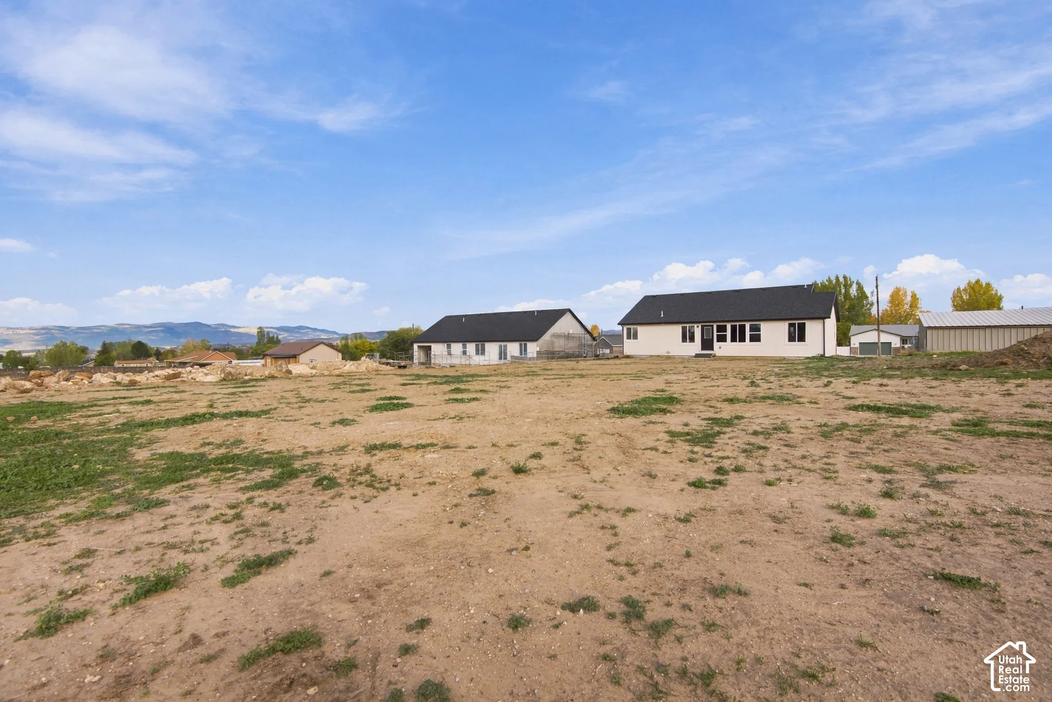 Expansive lot featuring neutral terrain and a mountain backdrop
