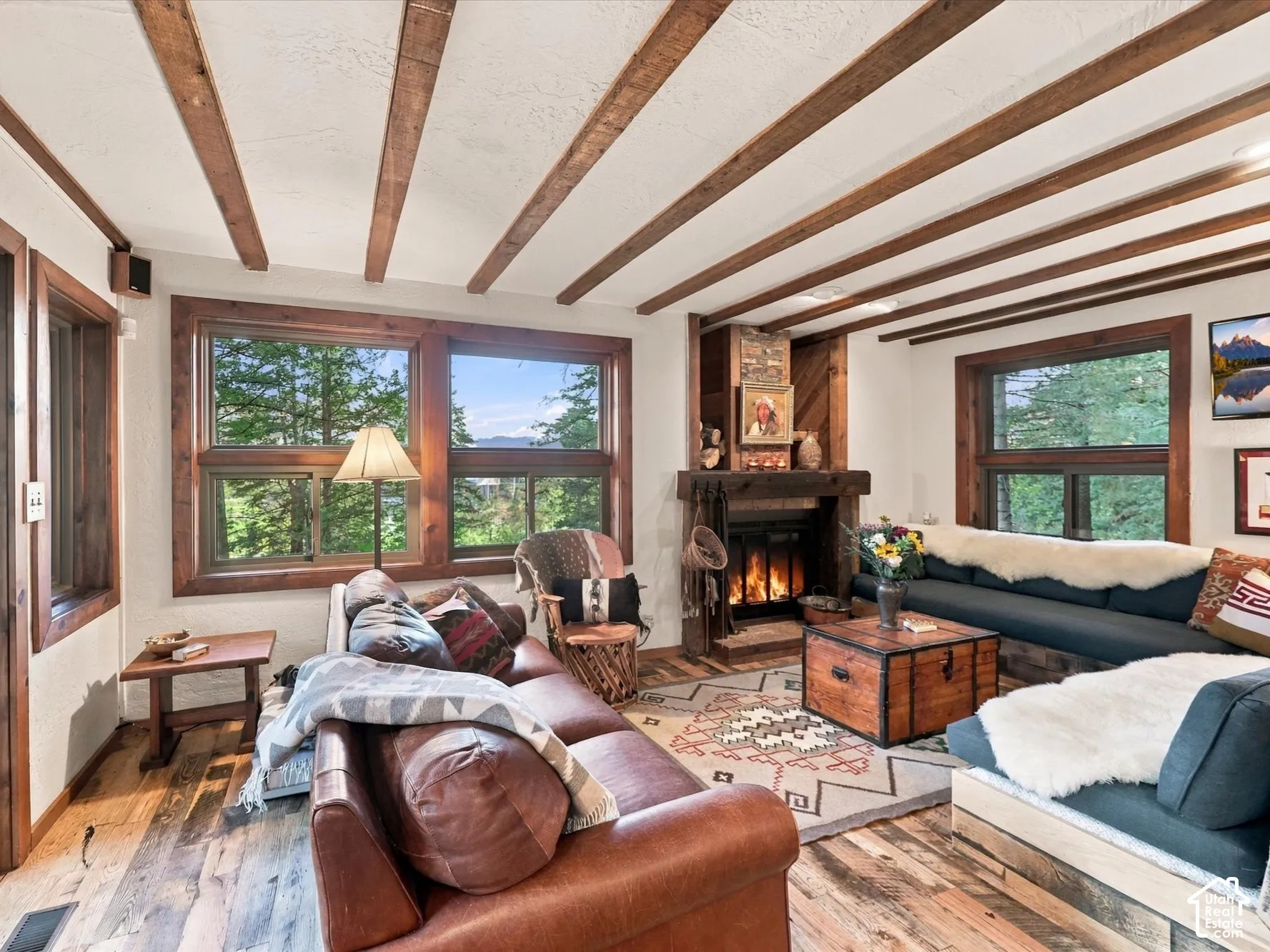 Window filled living room, welcomes the beauty of nature