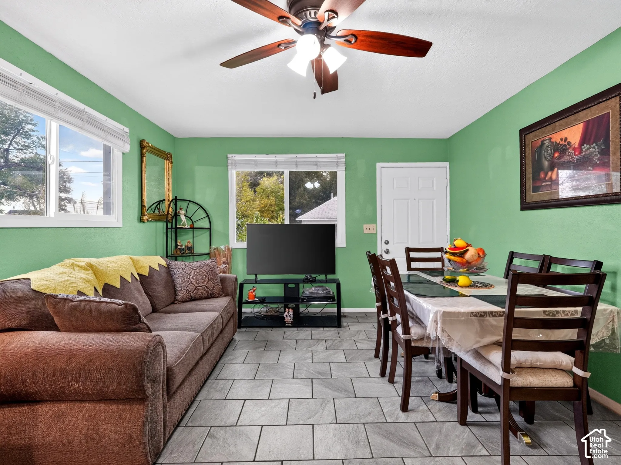 2 bedroom unit - Tile flooring, multi-pane windows, and a ceiling fan with integrated lighting