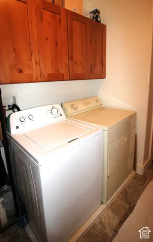 Wall-mounted natural wood-finish cabinetry and vinyl flooring