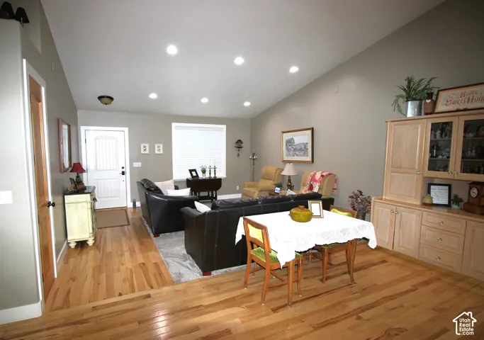 Spacious Front Room (Living Room)   with room for 2nd table if needed.  Beautiful Hickory Floors