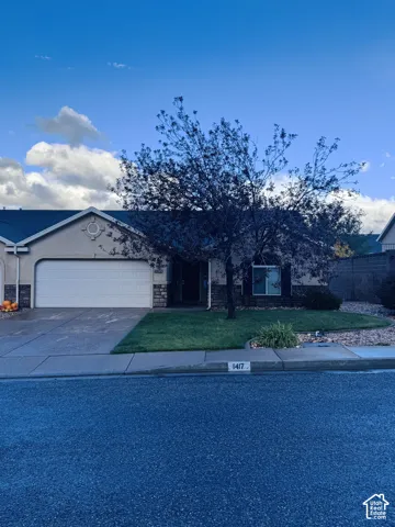 Single-story exterior featuring a stone and stucco fa