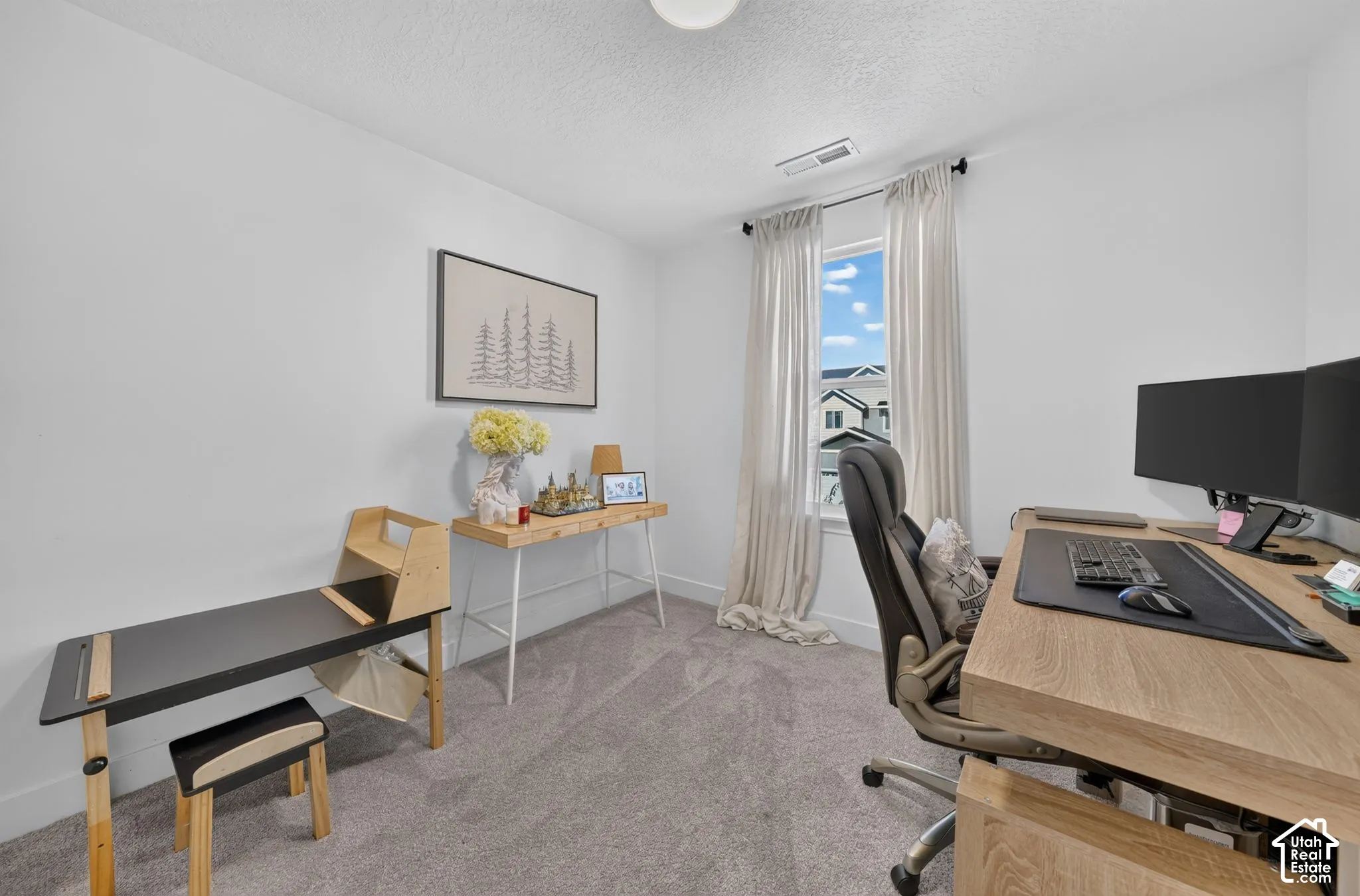 Neutral-toned interior space featuring neutral wall paint, wall-to-wall carpeting, and a window with a curtain rod fixture