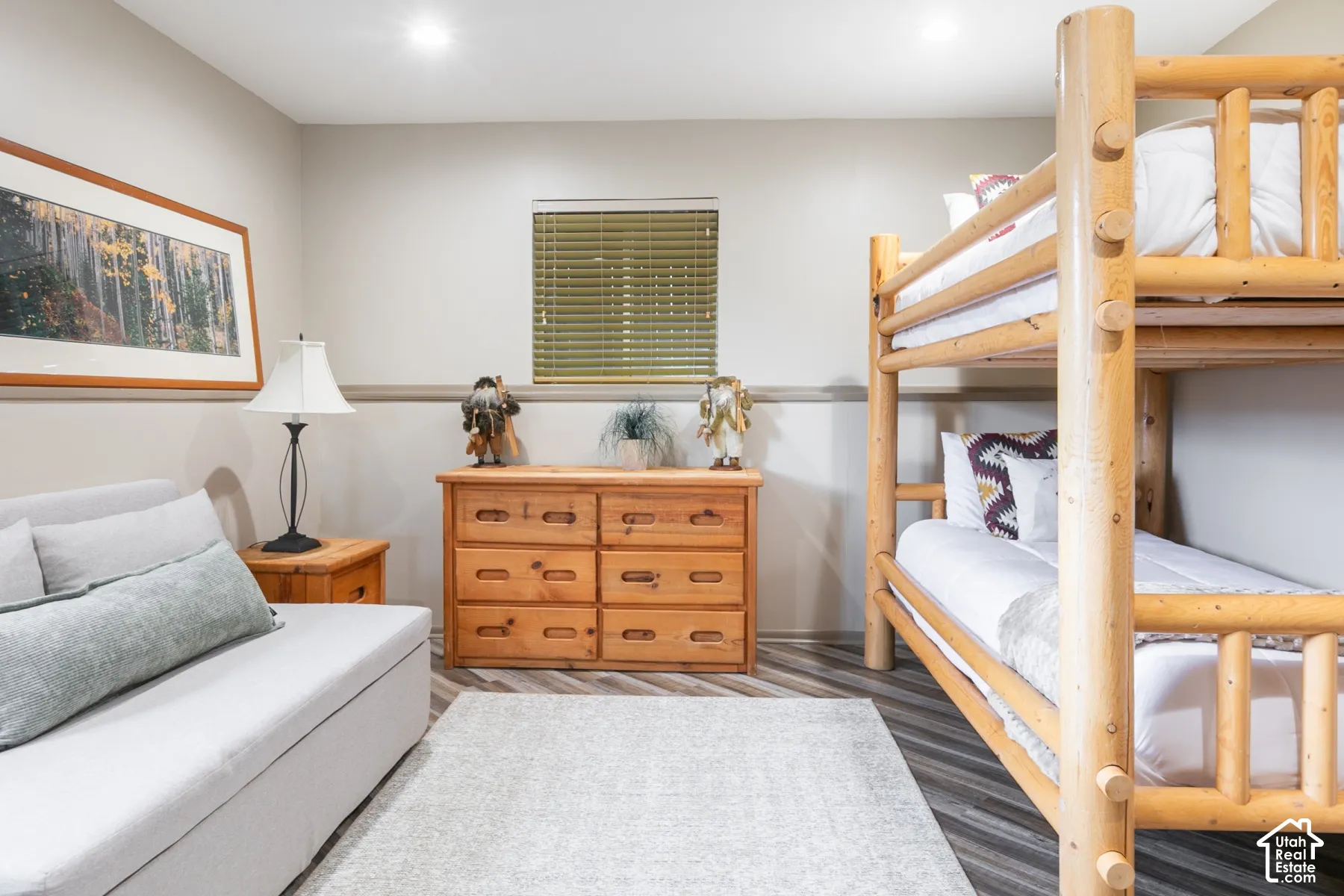 Neutral interior featuring wood-finish flooring, recessed lighting, and a chair rail