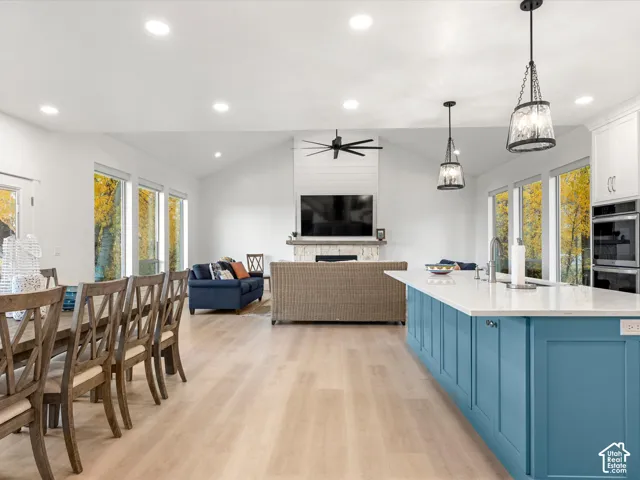 Open-concept interior featuring vaulted ceilings