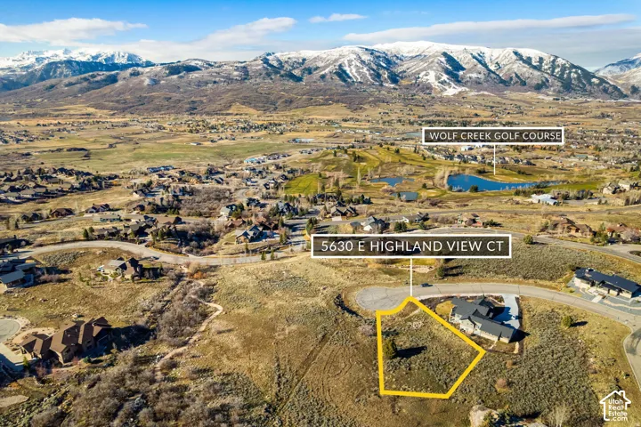 Aerial view of residential area featuring property parcel outlined and a water and mountain view