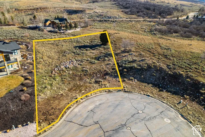 Aerial view of property and surrounding area with property parcel outlines