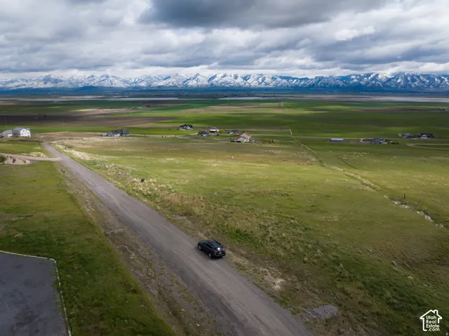 Aerial view of sparsely populated area with a mountainous background
