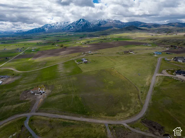 Aerial view of sparsely populated area with a mountainous background
