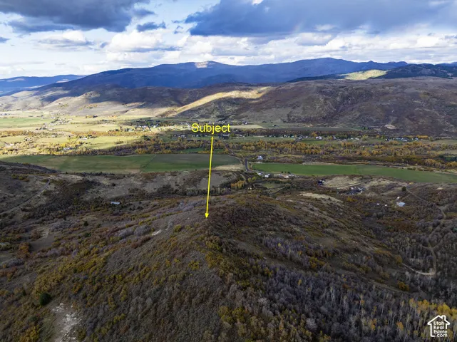 Elevated land parcel featuring expansive mountain topography and open terrain