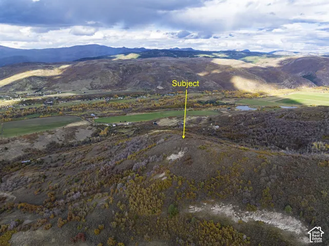 Elevated acreage featuring expansive mountain topography and panoramic valley scenery