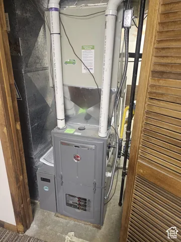 High-efficiency gas furnace unit featuring metal ductwork, PVC venting, and a dedicated gas supply line