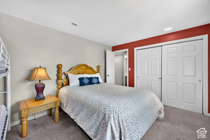 Neutral wall tones, accent wall, and double-door closet with six-panel doors