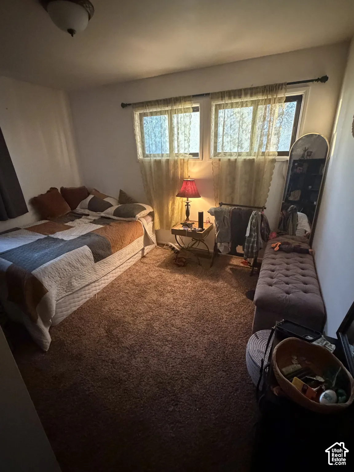 Room featuring dual windows, wall-to-wall carpeting, and a flush-mount ceiling light fixture