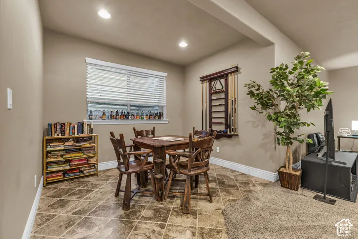 Tile flooring, recessed lighting, and built-in wall-mounted cue rack