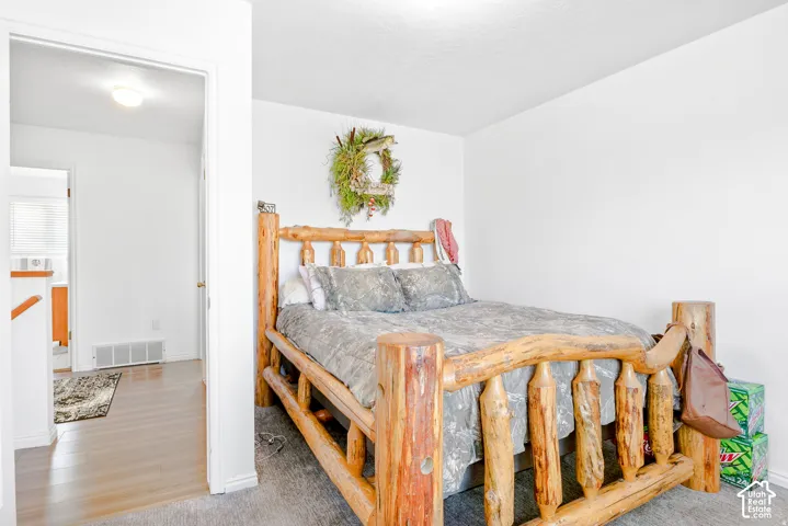 Neutral-toned interior space featuring light-colored wall finish and plush wall-to-wall carpeting