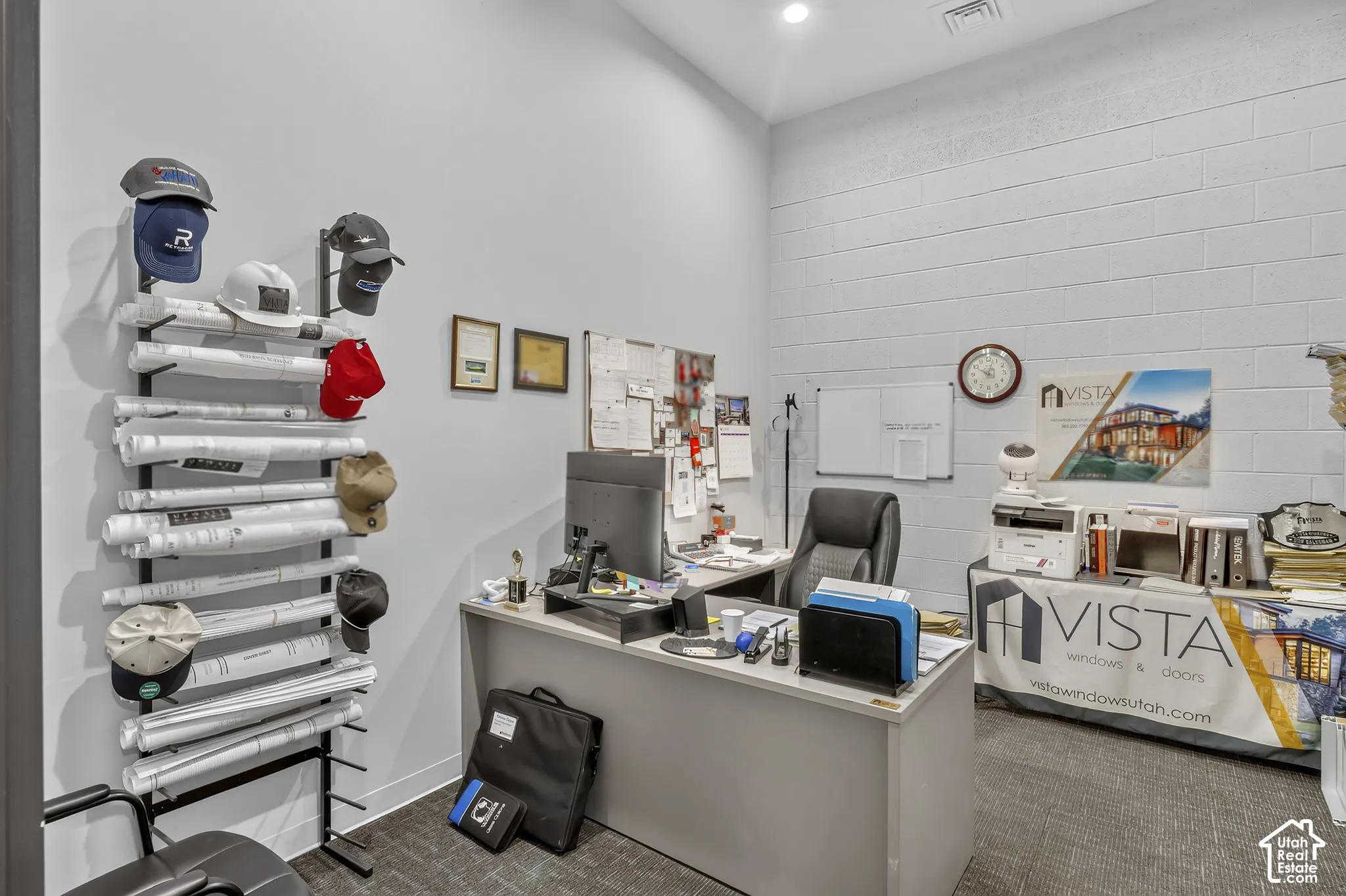 Interior space featuring high ceilings, painted concrete block walls, and recessed lighting