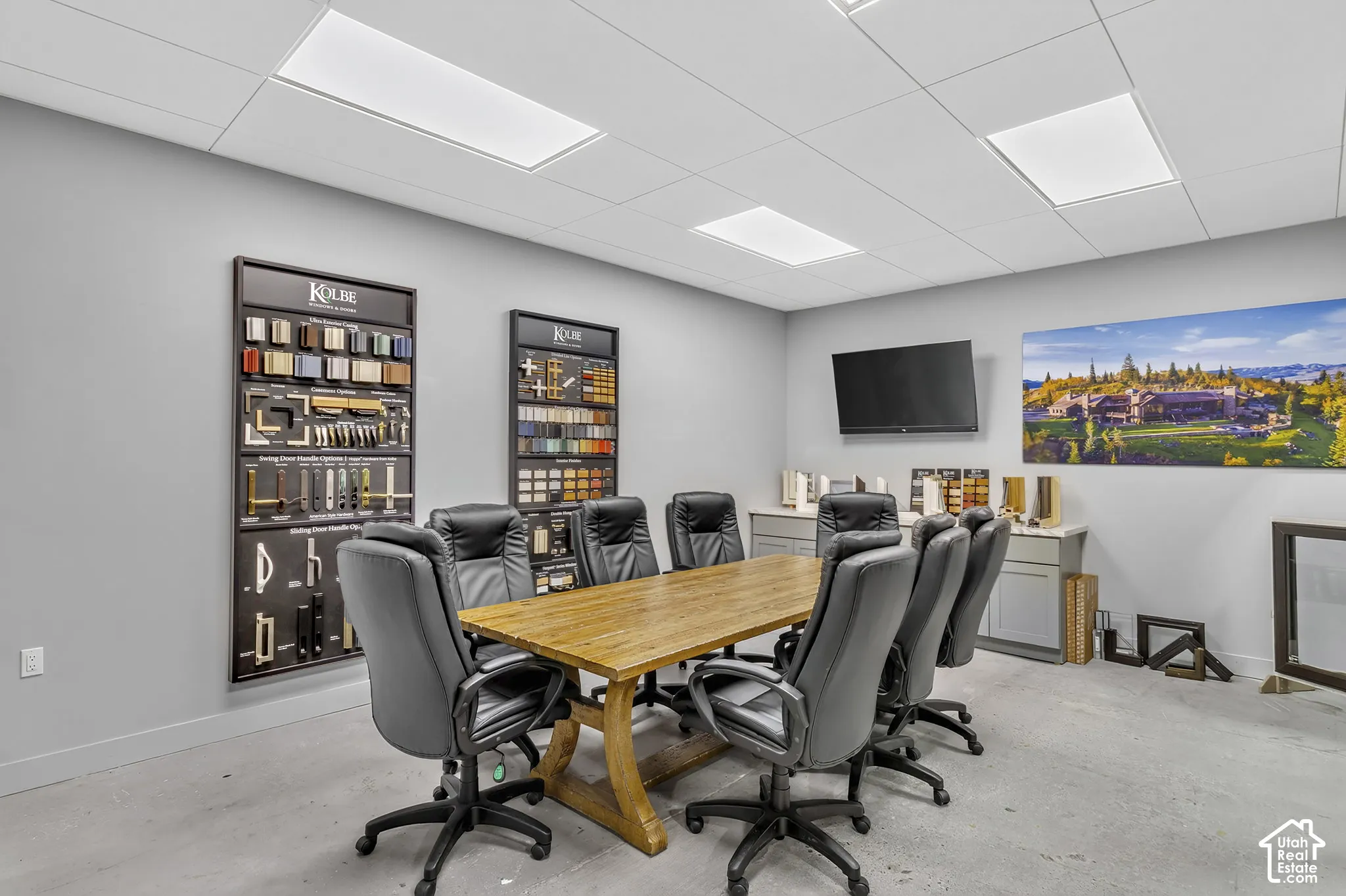 Drop-ceiling panels with recessed LED lighting, integrated cabinetry, and neutral-tone wall surfacing