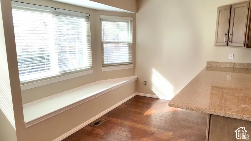 Bay window featuring a built-in bench, kitchen bar, built in bench with storage, flex extra dining space