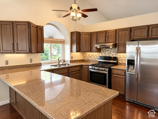 Glazed cabinets are lighter in person., stainless appliances, granite counter tops