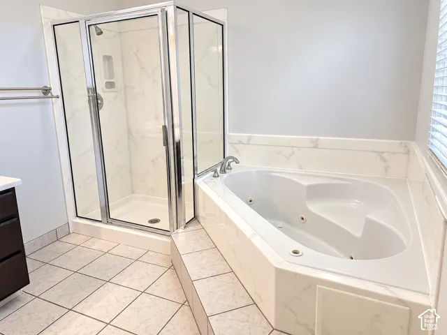 Primary bathroom featuring separate tub/shower combo