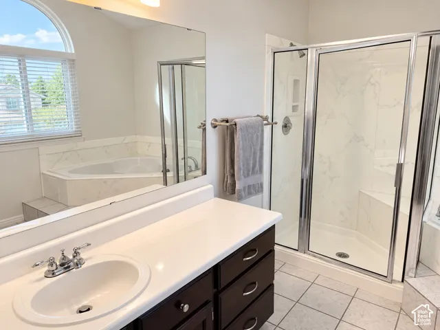 Primary bathroom featuring separate tub/shower combo