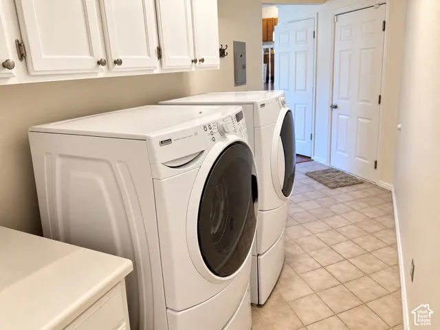 Large laundry area featuring extra storage space