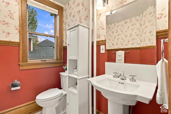 Full bathroom on the main floor with new sink and toilet and some nice storage cabinets.