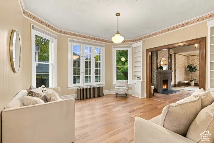 Family room with lovely bay window, beautiful built-in cabinets, and new oak flooring.