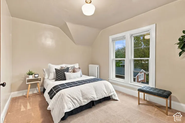 Bedroom with windows and new drywall, plaster, and paint.