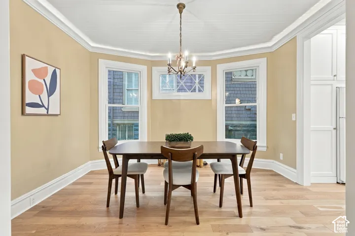 Large dining area with gorgeous windows and newer oak flooring.