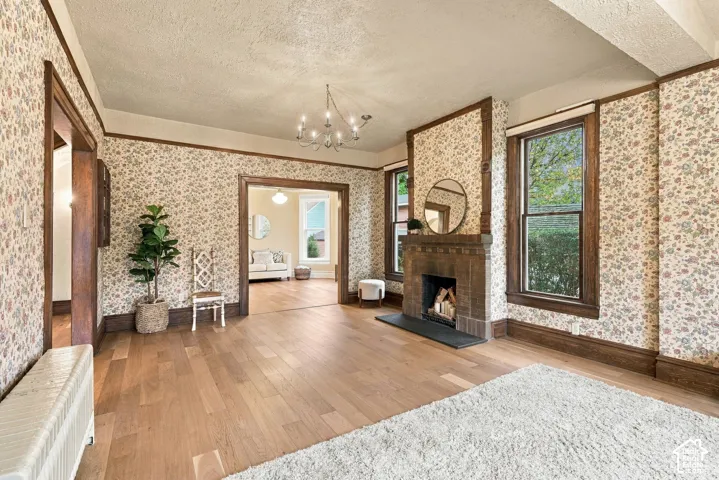 Spacious living room with new oak flooring and a cozy fireplace.