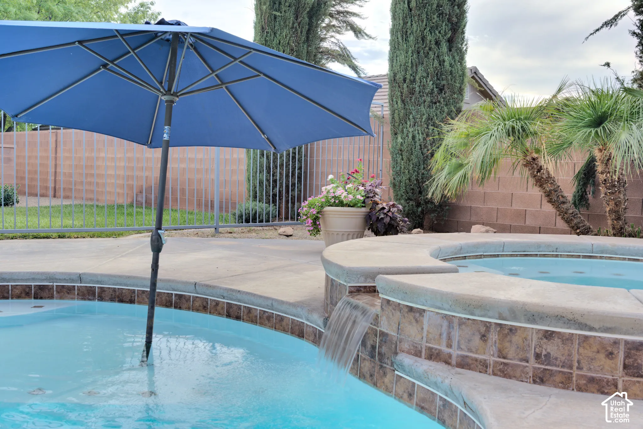 The spa spills over into the pool.