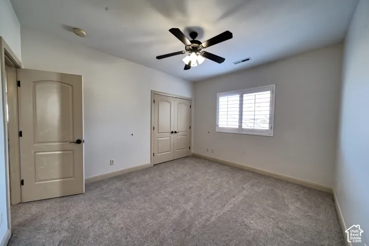 Upstairs bedroom with a double-door closet.