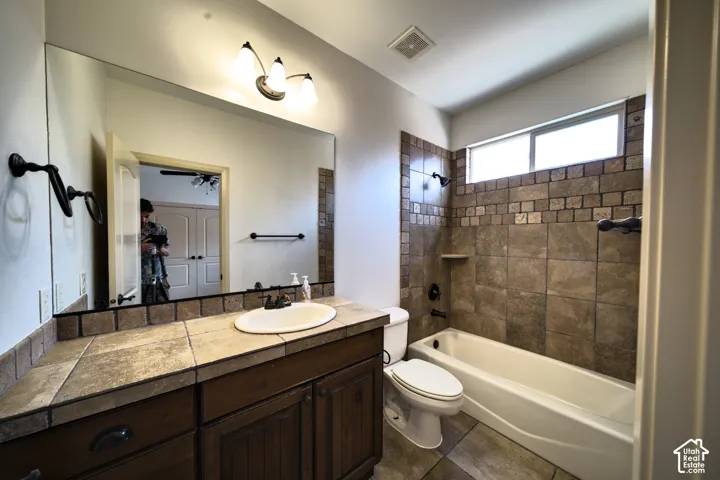 Bathroom for the second main-floor bedroom, with a tub and shower.