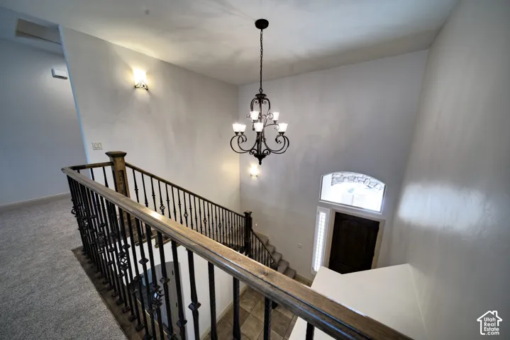 View from the upstairs landing down to the two-story entry.