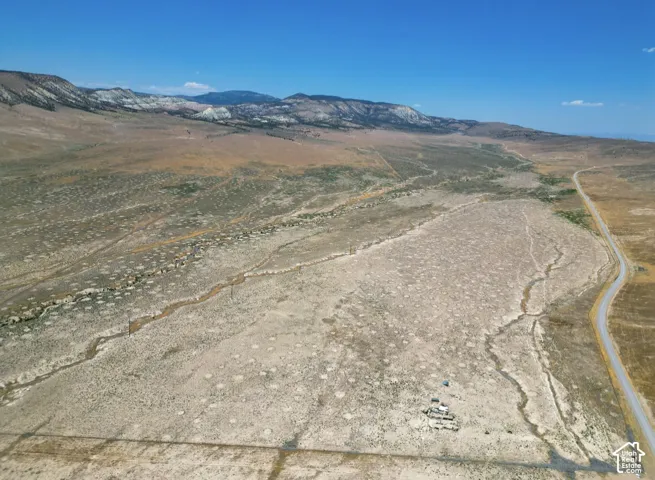 Expansive acreage featuring rugged desert terrain, native vegetation, and prominent mountain backdrops