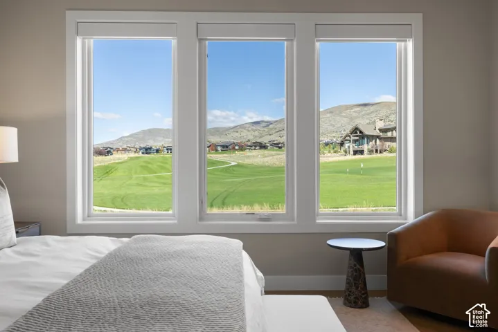 Triple-pane window configuration featuring white trim and expansive mountain and landscape scenery