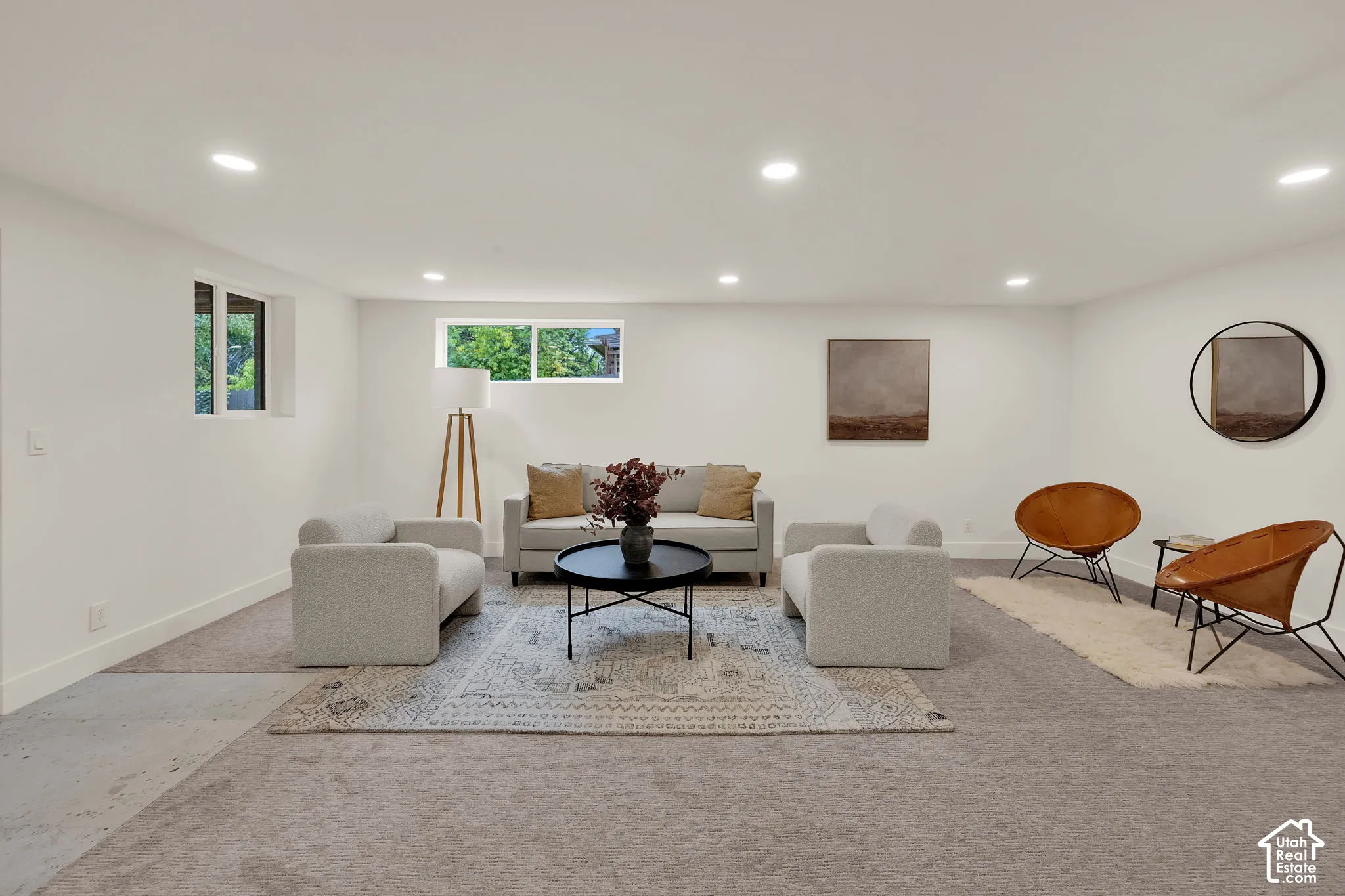 Neutral color palette, recessed lighting, carpeted flooring, and slider windows