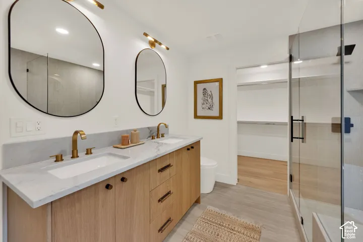 Primary bathroom featuring a dual-sink vanity