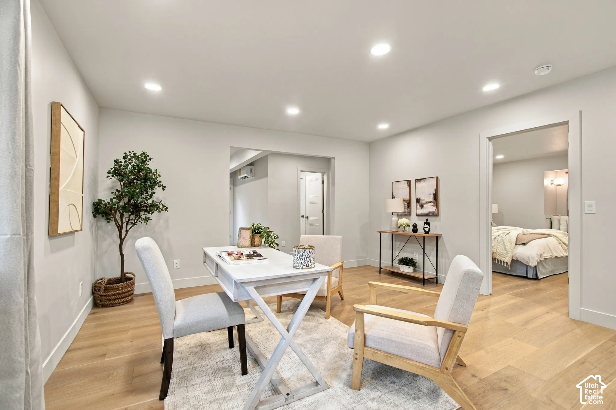 Interior space featuring light wood-finish flooring, recessed lighting, and crisp neutral wall paint